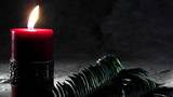 Red Candle And Palms